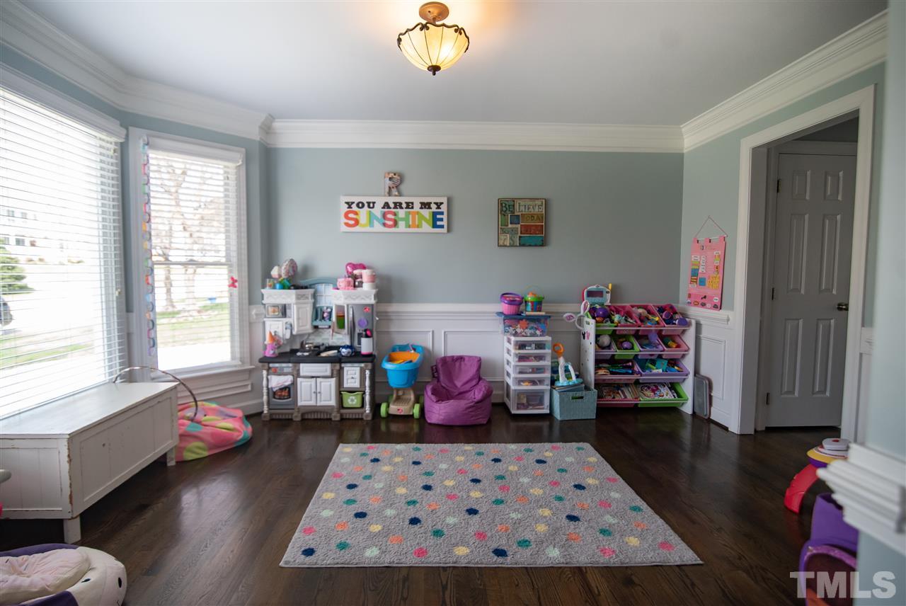 9116 Dawnshire Road Raleigh, NC 27615 - Photo 6 of 30 a living room with furniture and a wooden floor
