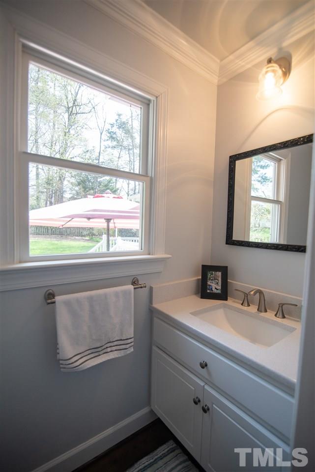 9116 Dawnshire Road Raleigh, NC 27615 - Photo 7 of 30 a bathroom with a sink and a window