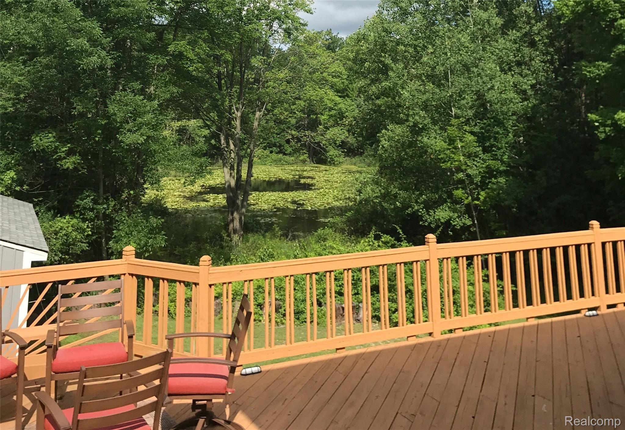10081 Gibbs Road Clarkston, MI 48348 - Photo 43 of 57 Huge deck w/ hot tub looking over pond