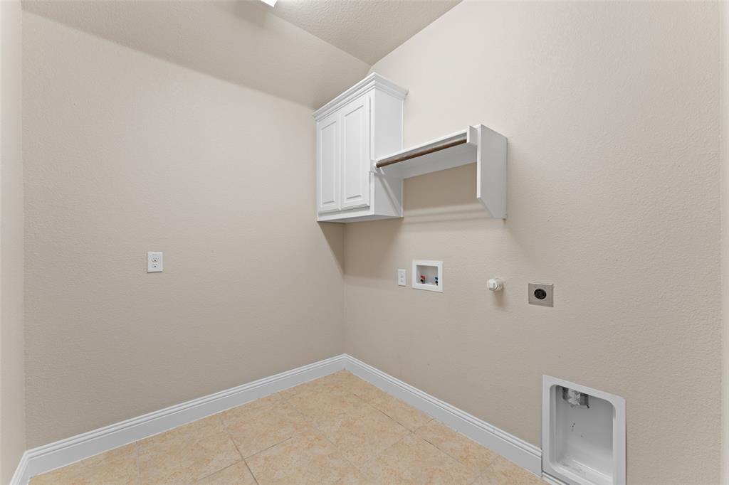 600 Fishback Circle Plano, TX 75074 - Photo 22 of 38 a view of a microwave and cabinet