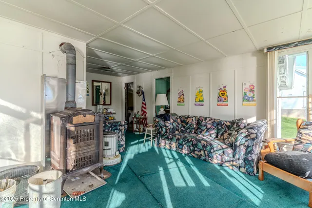 a bedroom with a bed and windows