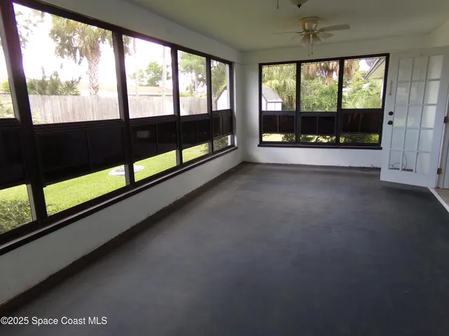 a view of an empty room with a large window