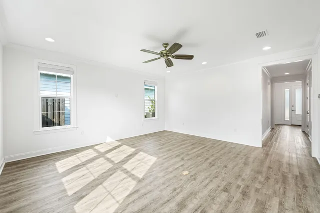 a view of a kitchen with wooden floor and entryway