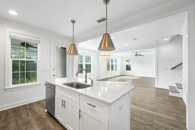a kitchen with a sink and stove