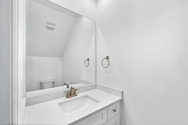 a view of empty room with wooden floor and window