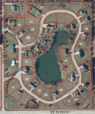 an aerial view of a house with a swimming pool