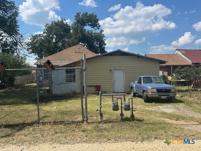 111 North 23rd Street Temple, TX 76504 - Photo 6 of 6 a backyard of a house with table and chairs
