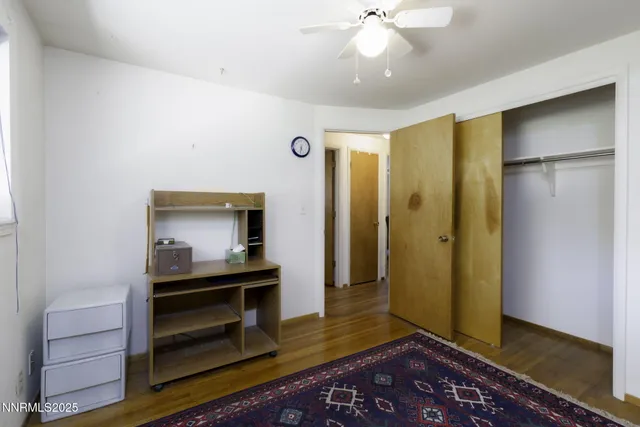 a room with lots of furniture and a garden