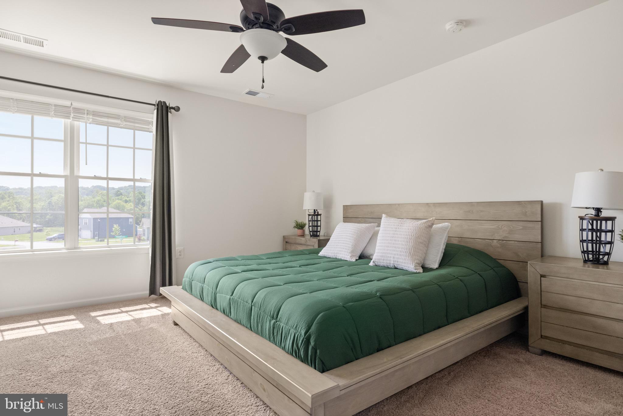 259 Headwaters Drive Falling Waters, WV 25419 - Photo 17 of 34 a bedroom with a large bed and a window