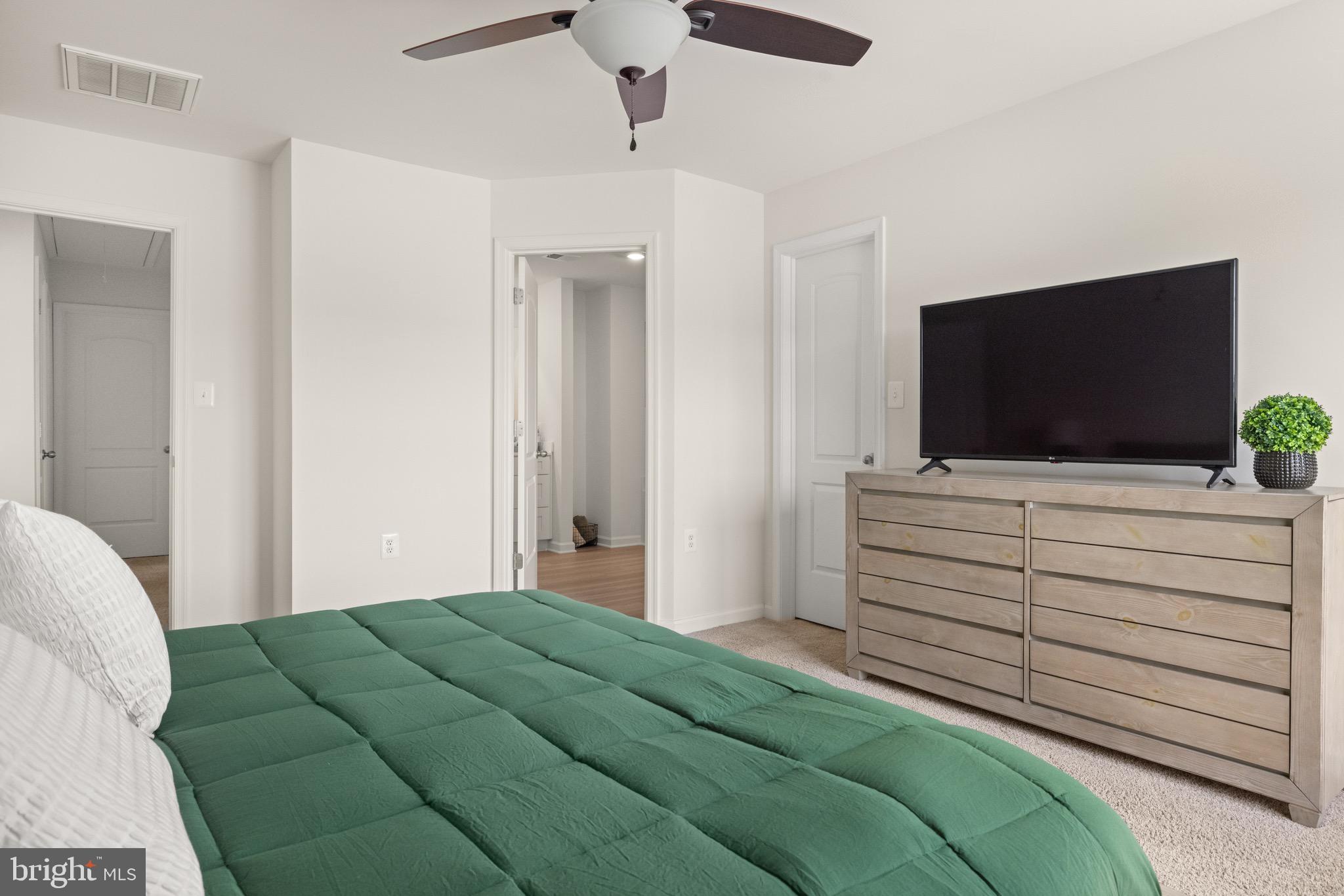 259 Headwaters Drive Falling Waters, WV 25419 - Photo 18 of 34 a bedroom with a bed and flat screen tv