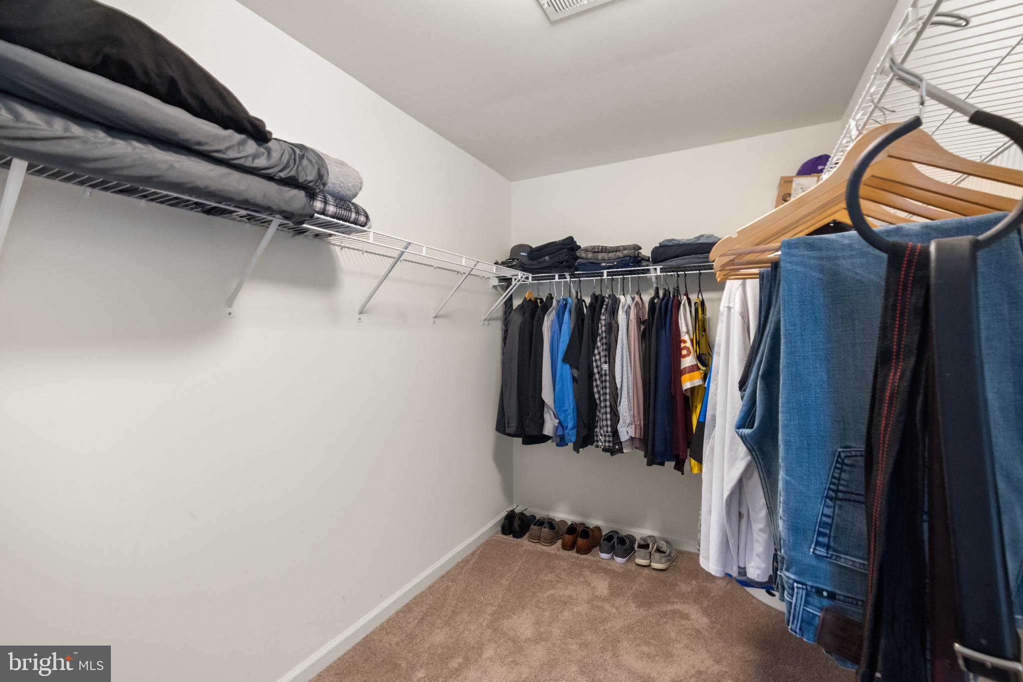 259 Headwaters Drive Falling Waters, WV 25419 - Photo 19 of 34 a view of walk in closet with clothes