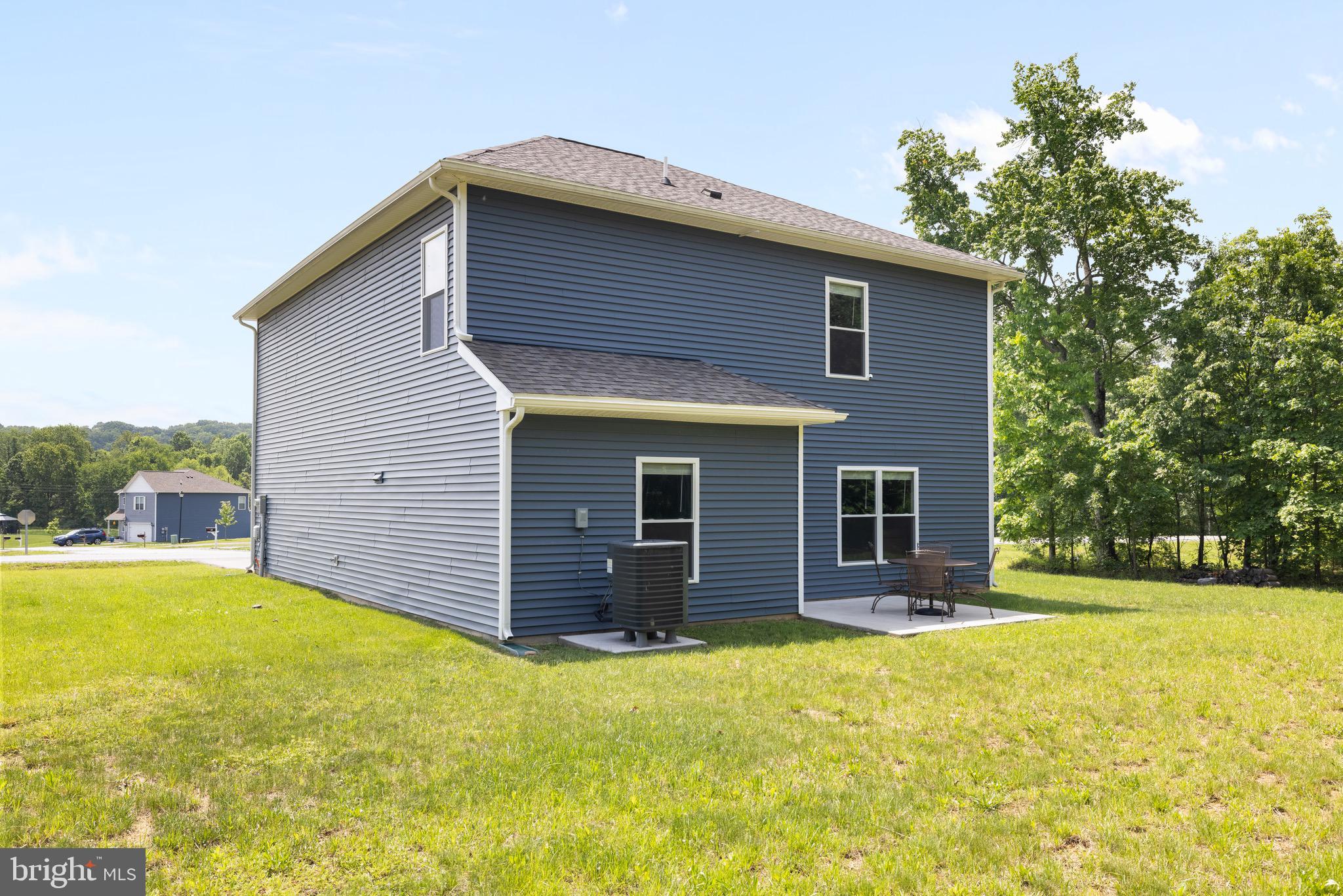 259 Headwaters Drive Falling Waters, WV 25419 - Photo 24 of 34 a front view of house with yard and trees