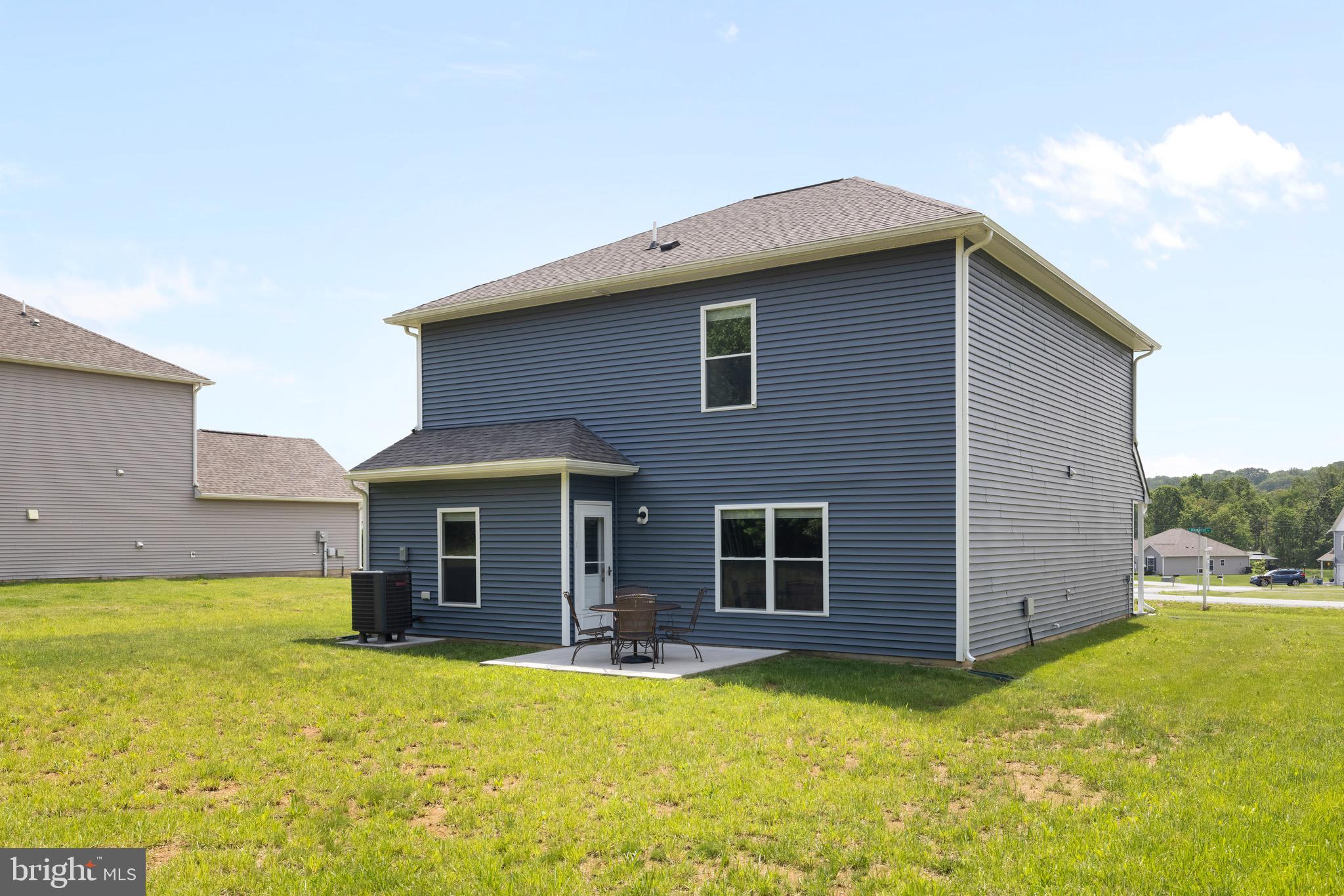 259 Headwaters Drive Falling Waters, WV 25419 - Photo 26 of 34 a front view of a house with yard and garage