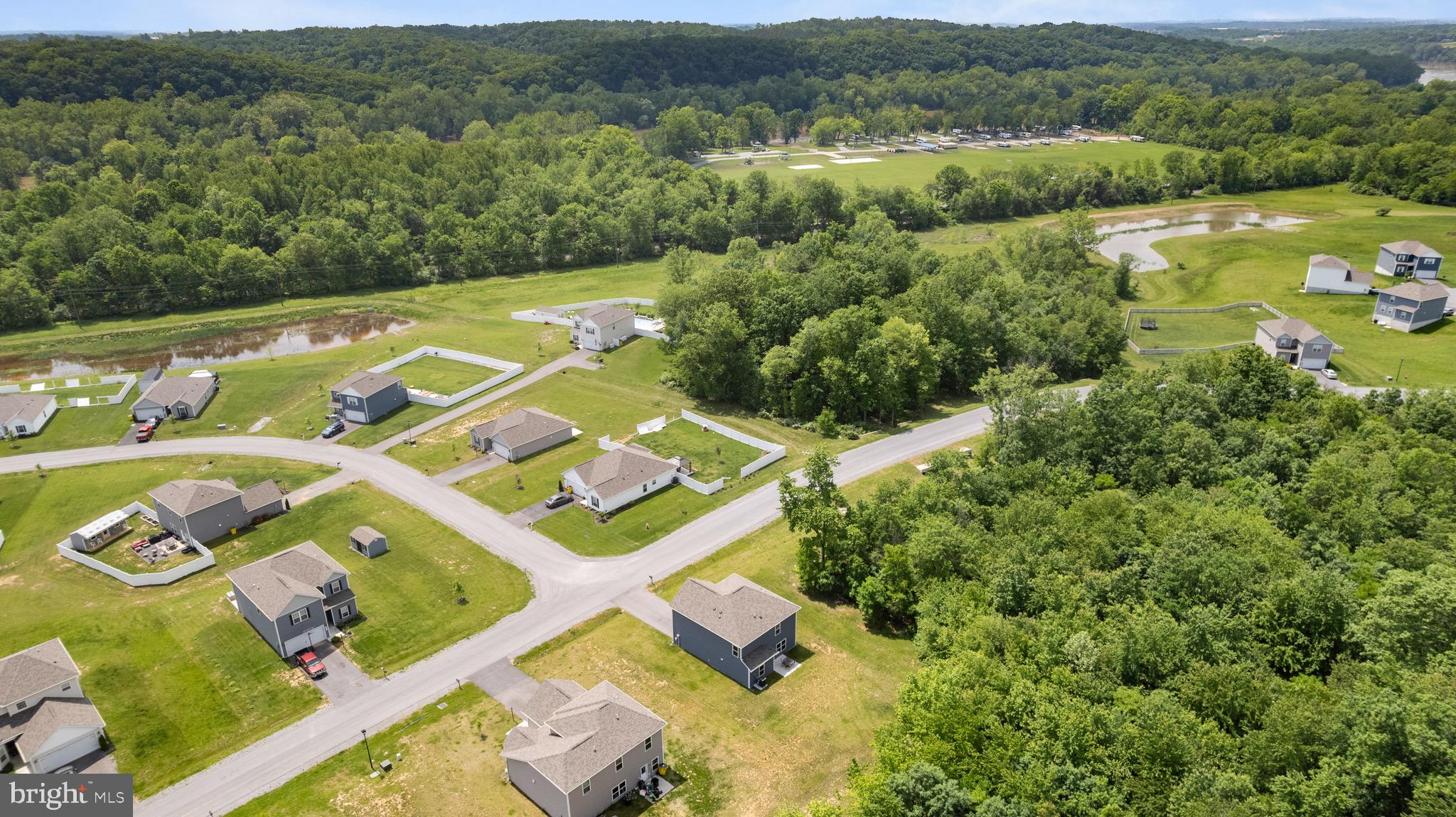 259 Headwaters Drive Falling Waters, WV 25419 - Photo 30 of 34 an aerial view of a house with a garden