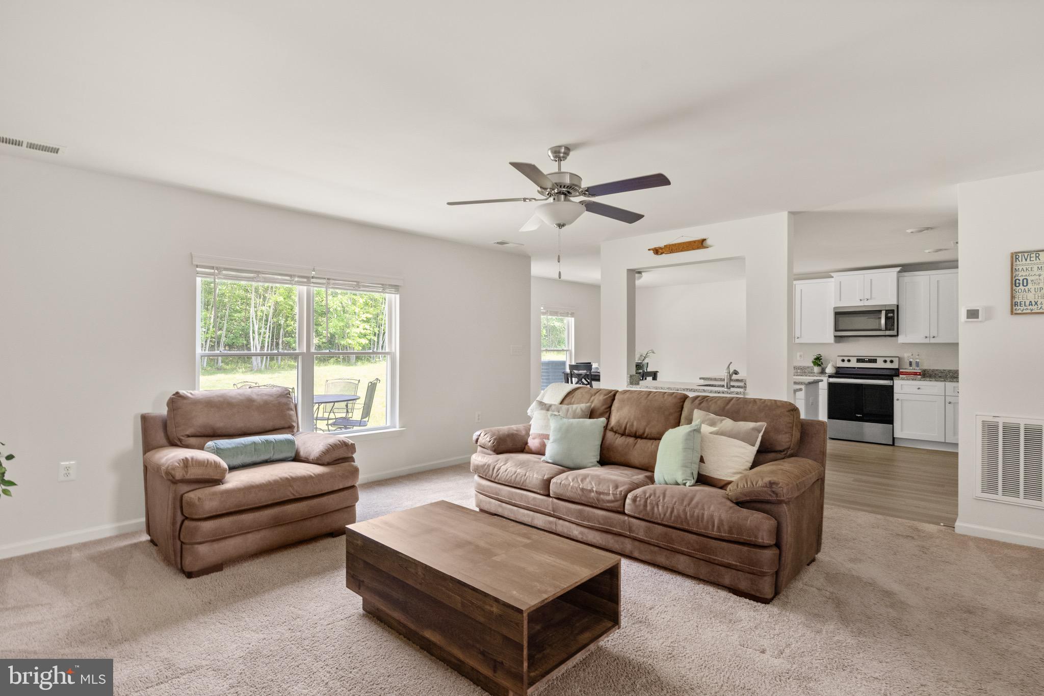 259 Headwaters Drive Falling Waters, WV 25419 - Photo 6 of 34 a living room with furniture and a large window