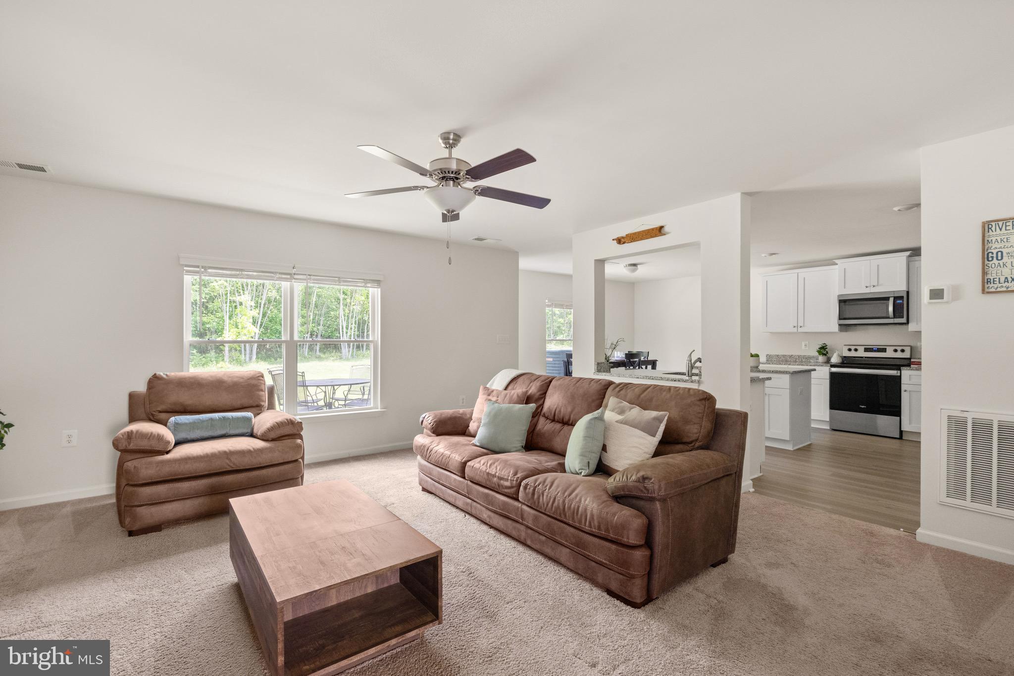 259 Headwaters Drive Falling Waters, WV 25419 - Photo 7 of 34 a living room with furniture and a large window