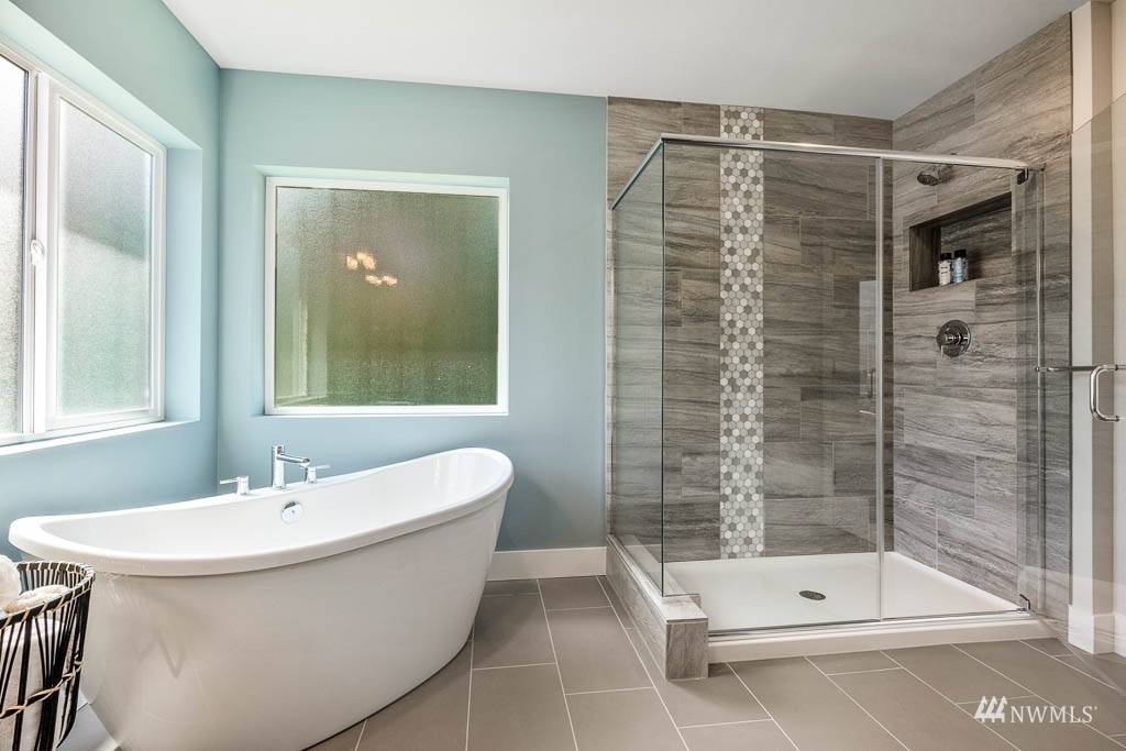 609 215th Street Southeast, Unit RM23 Bothell, WA 98021 - Photo 13 of 23 a bathroom with a bathtub and a shower