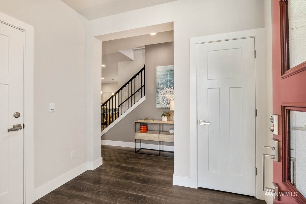 609 215th Street Southeast, Unit RM23 Bothell, WA 98021 - Photo 14 of 23 a view of a hallway with wooden floor and entryway