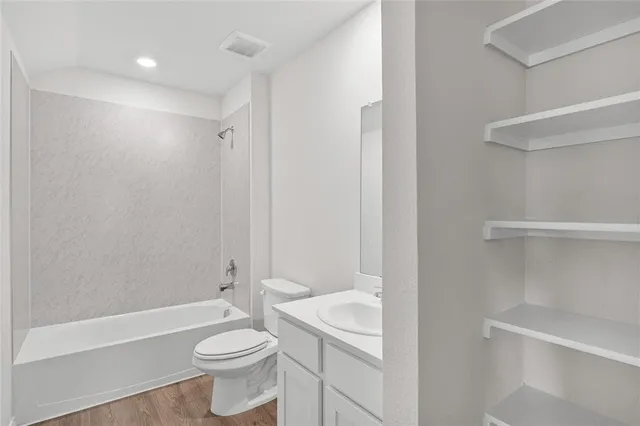 a view of a backyard with a garden and swing