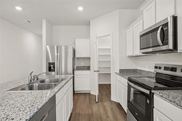 an aerial view of a house with outdoor space