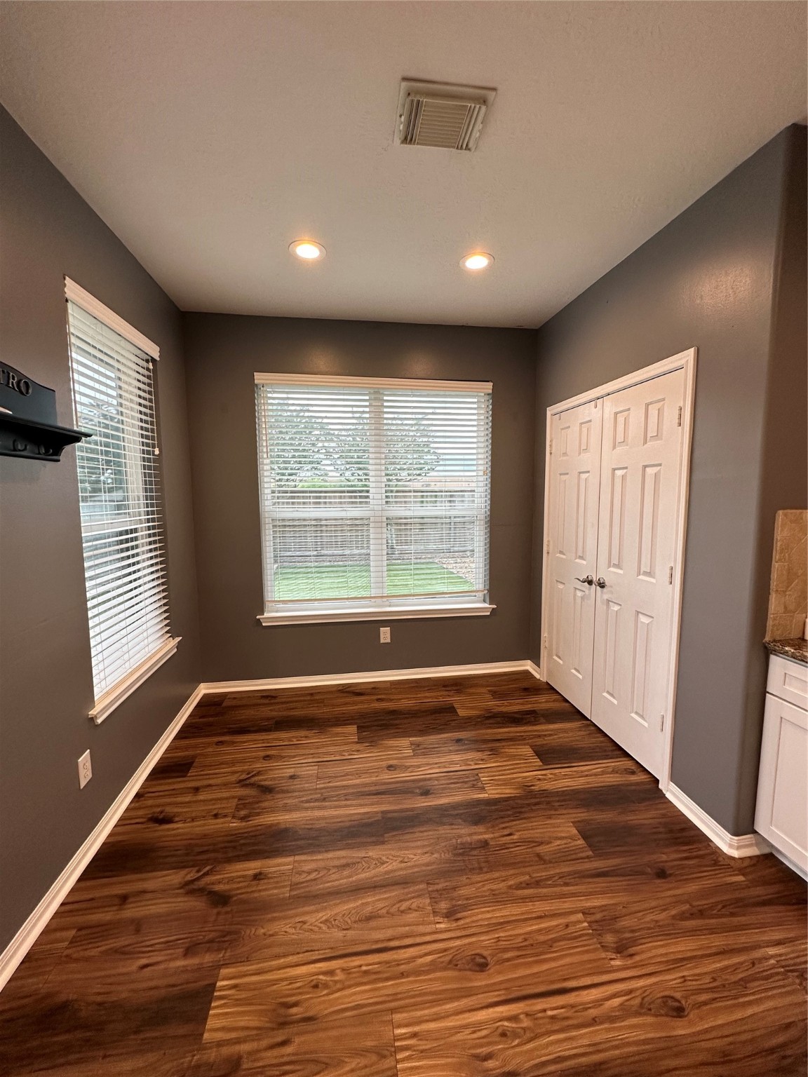 20235 Concord Hill Drive Cypress, TX 77433 - Photo 12 of 27 a view of an empty room with wooden floor and a window