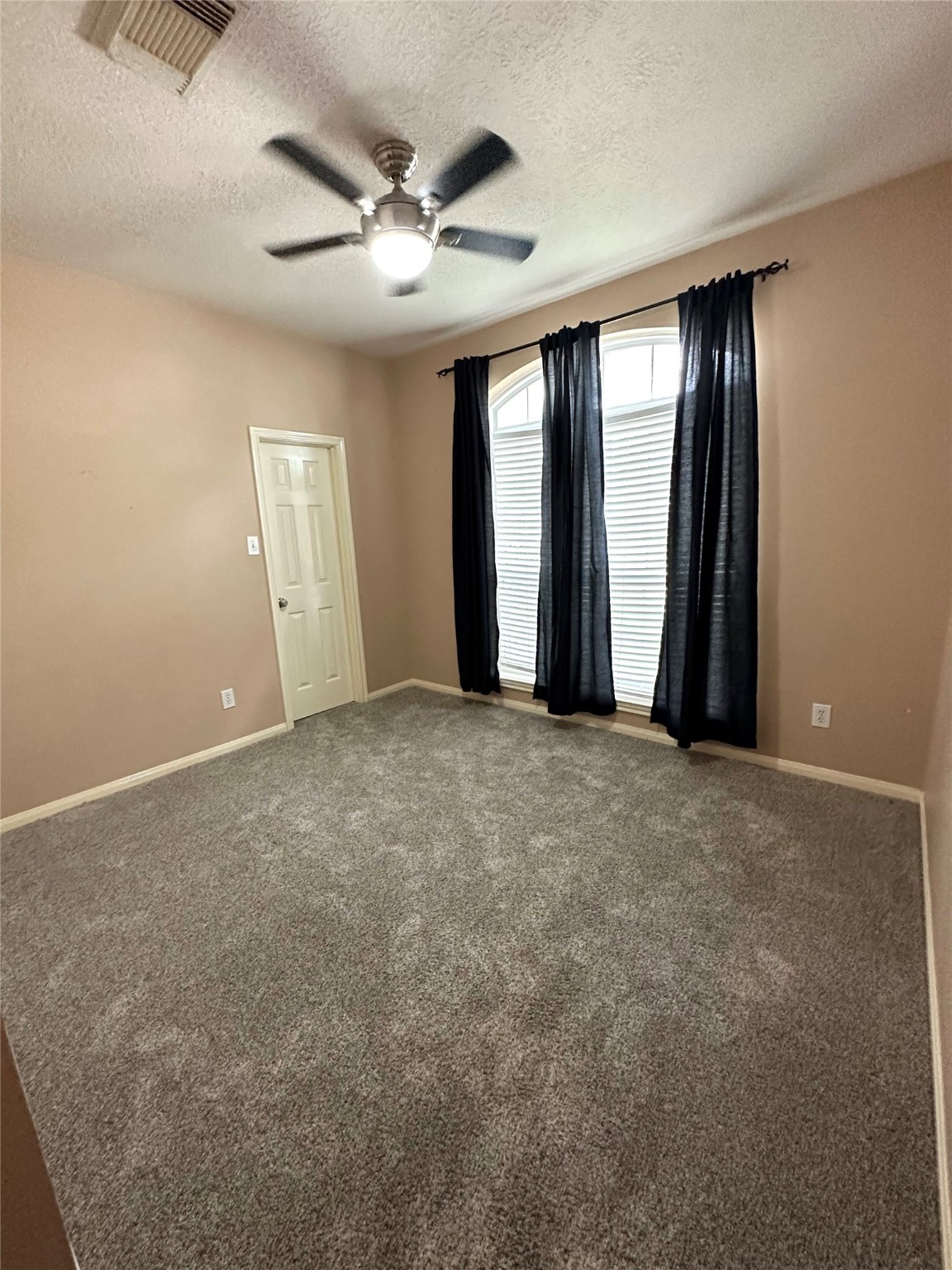 20235 Concord Hill Drive Cypress, TX 77433 - Photo 23 of 27 an empty room with windows and fan