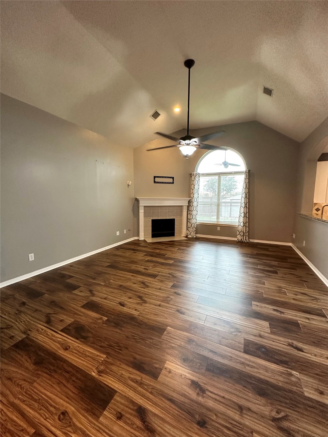 20235 Concord Hill Drive Cypress, TX 77433 - Photo 4 of 27 an empty room with wooden floor fireplace and windows
