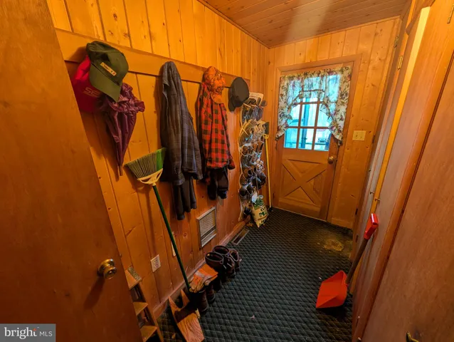 a view of walk in closet with clothes