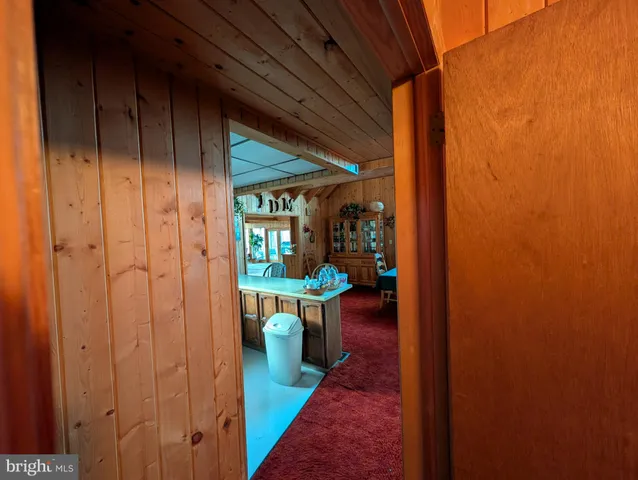 a view of a room with a table and chairs