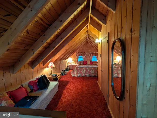a view of living room with furniture and a fireplace