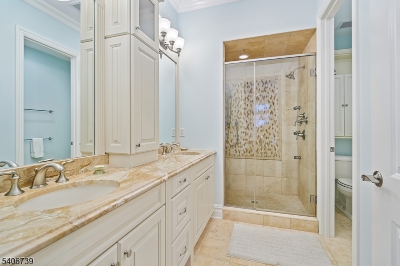 14 Euclid Avenue, Unit 102 Summit, NJ 07901 - Photo 11 of 20 a bathroom with a granite countertop sink a shower and a mirror