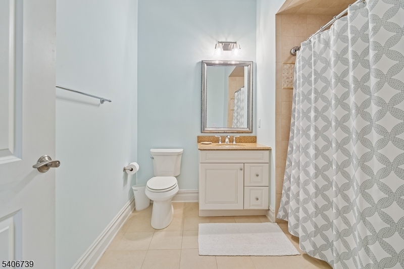 14 Euclid Avenue, Unit 102 Summit, NJ 07901 - Photo 14 of 20 a bathroom with a toilet a sink and garden