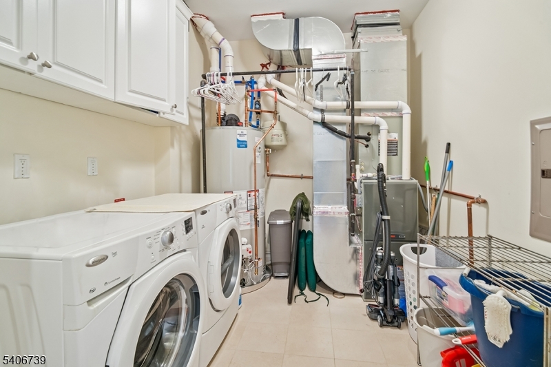 14 Euclid Avenue, Unit 102 Summit, NJ 07901 - Photo 16 of 20 a view of storage and utility room with washer and dryer