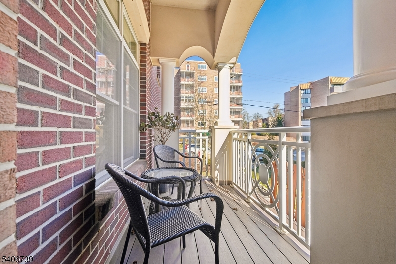 14 Euclid Avenue, Unit 102 Summit, NJ 07901 - Photo 17 of 20 a view of a balcony with chairs