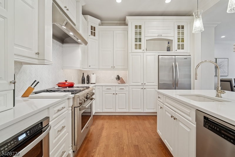 14 Euclid Avenue, Unit 102 Summit, NJ 07901 - Photo 6 of 20 a kitchen with white cabinets and white appliances