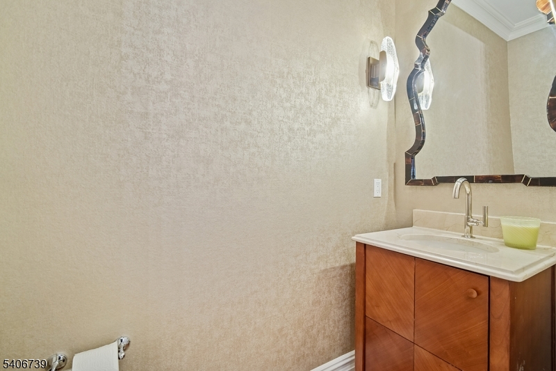 14 Euclid Avenue, Unit 102 Summit, NJ 07901 - Photo 9 of 20 a bathroom with a sink vanity and a mirror