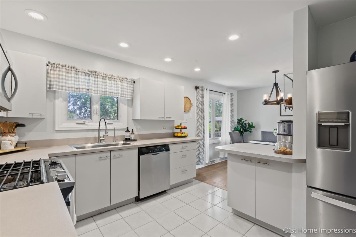 15309 Walnut Road Oak Forest, IL 60452 - Photo 11 of 26 a kitchen with white cabinets and white appliances