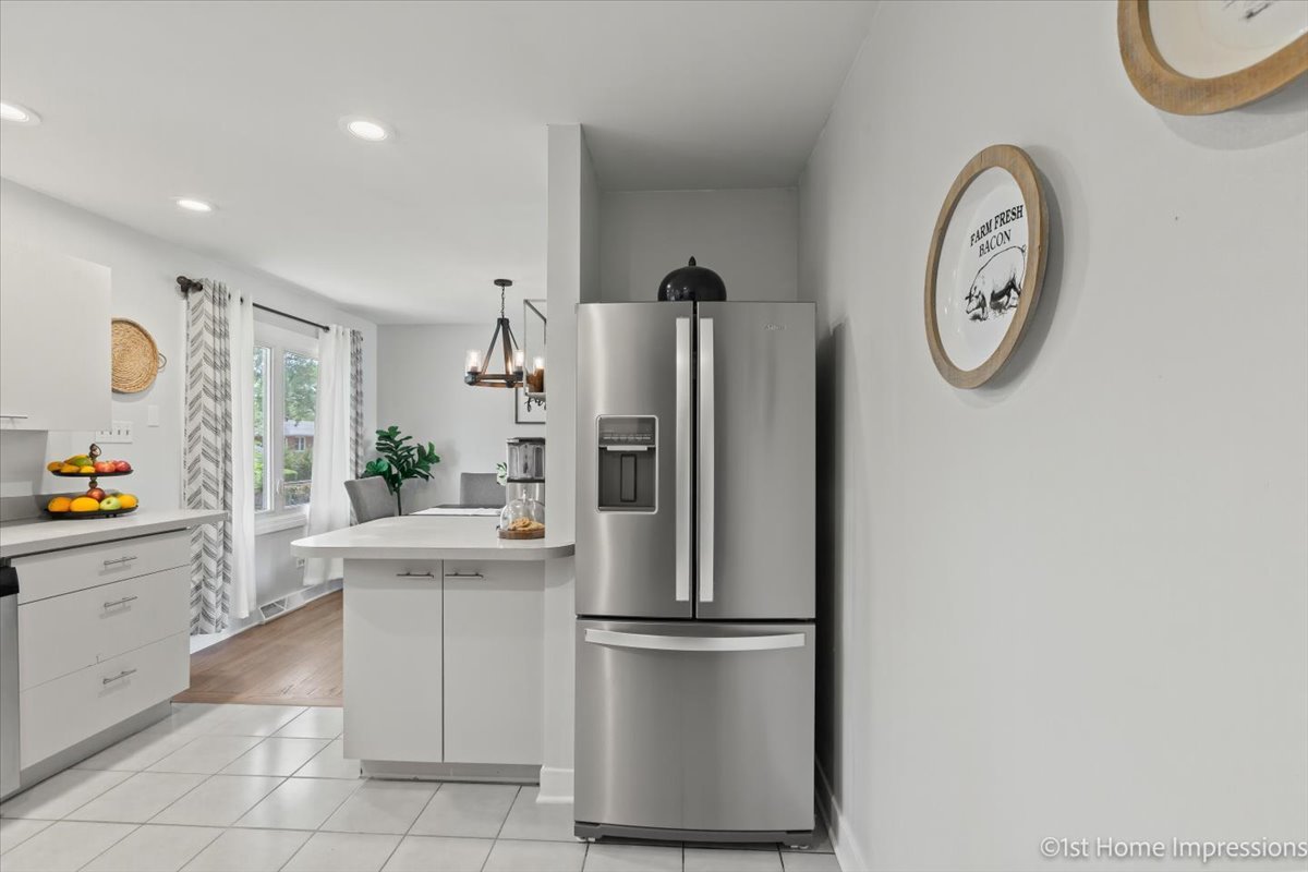 15309 Walnut Road Oak Forest, IL 60452 - Photo 12 of 26 a kitchen with a refrigerator a sink and a stove