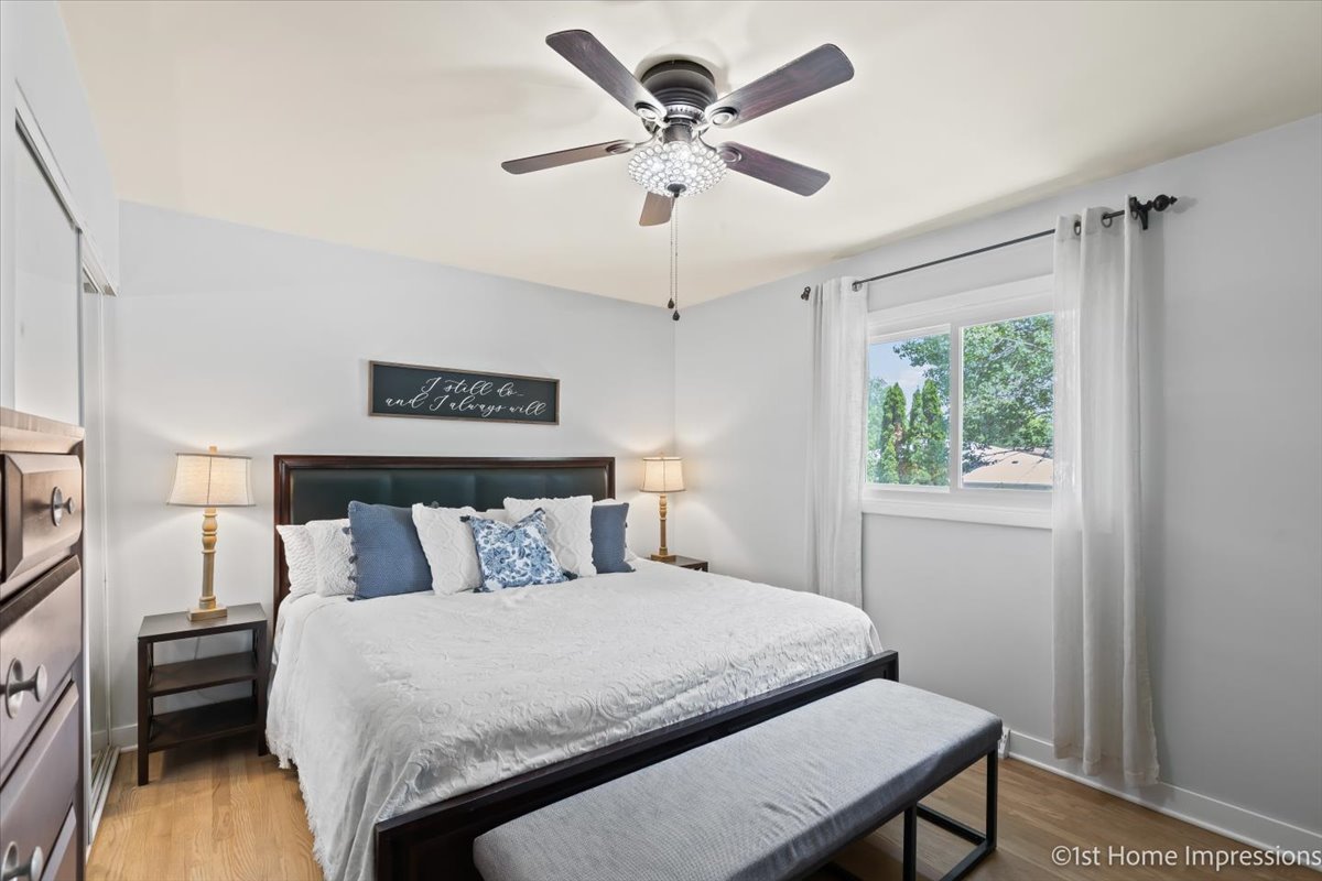 15309 Walnut Road Oak Forest, IL 60452 - Photo 13 of 26 a bedroom with a bed and a table