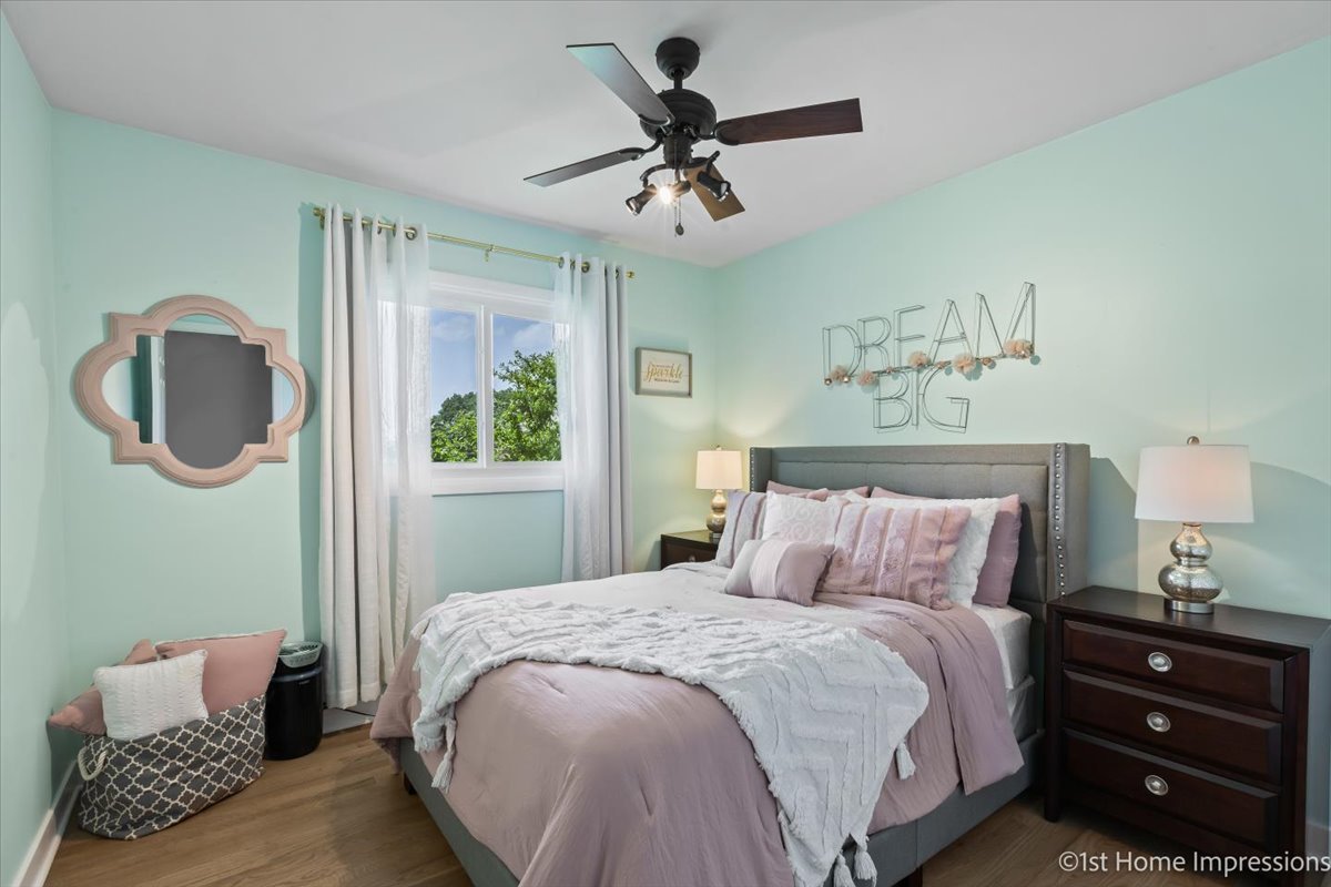 15309 Walnut Road Oak Forest, IL 60452 - Photo 16 of 26 a bedroom with a bed and a dresser