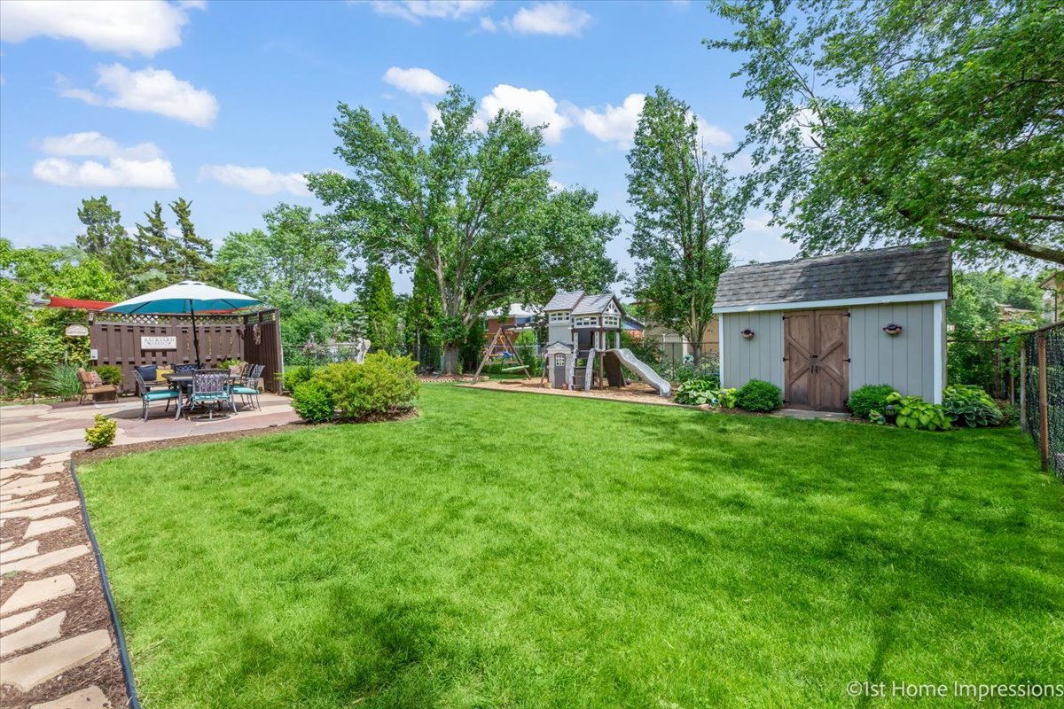 15309 Walnut Road Oak Forest, IL 60452 - Photo 23 of 26 a view of a house with backyard porch and sitting area