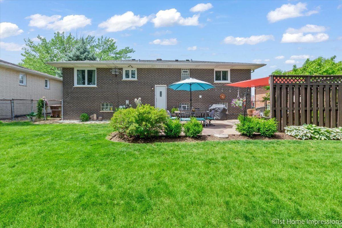 15309 Walnut Road Oak Forest, IL 60452 - Photo 25 of 26 a front view of house with yard and green space