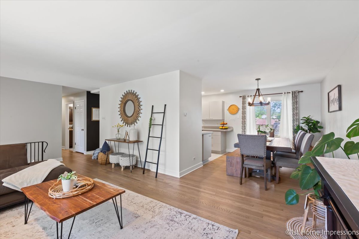 15309 Walnut Road Oak Forest, IL 60452 - Photo 6 of 26 a living room with furniture a rug and a table