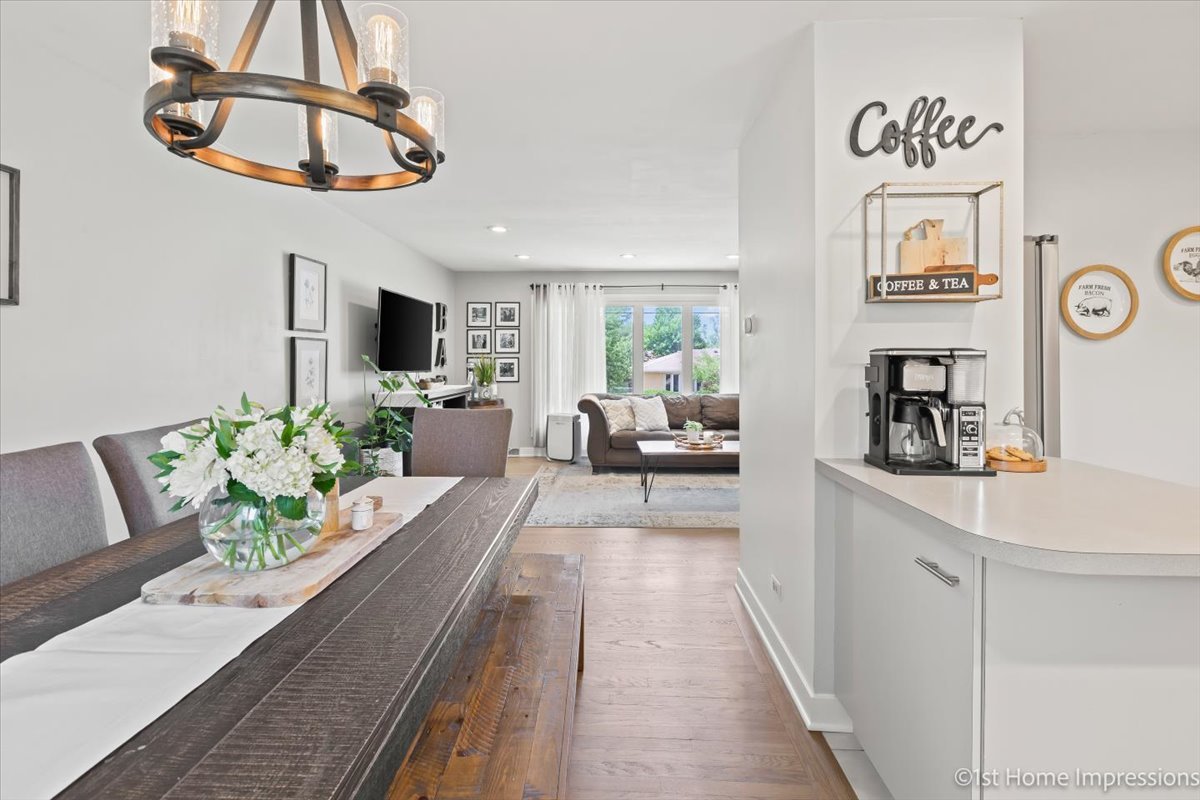 15309 Walnut Road Oak Forest, IL 60452 - Photo 8 of 26 a living room with furniture a chandelier a rug and a chandelier