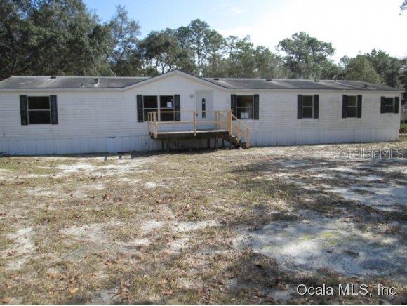 1959 South Colonial Avenue Homosassa, FL 34448 - Photo 1 of 1 a view of a house with a backyard