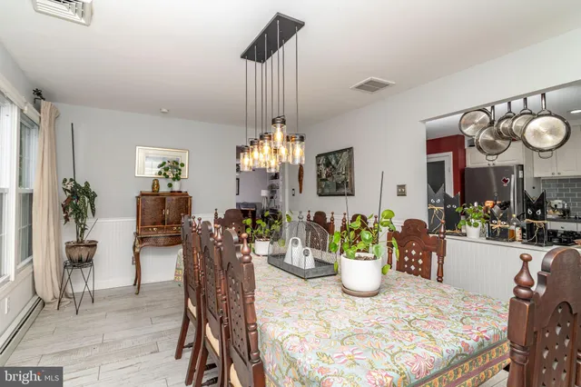a view of a dining room and a chandelier