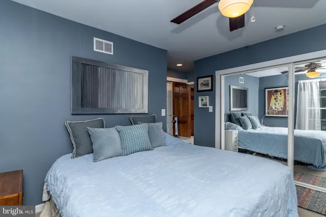 a white toilet sitting next to a bathroom sink