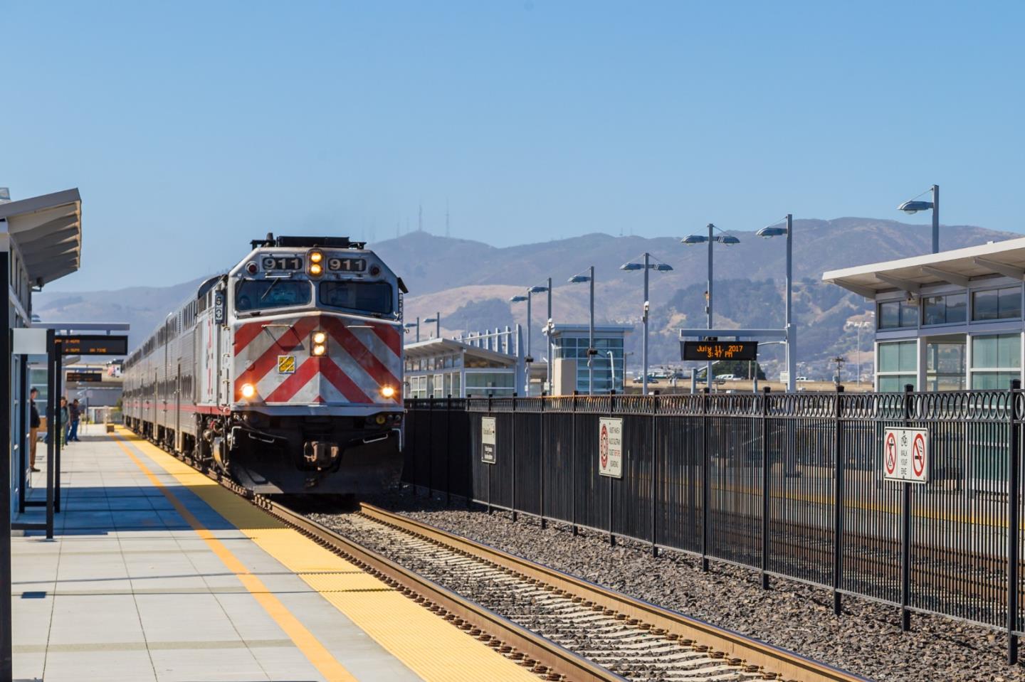 5 La Mancha Place Millbrae, CA 94030 - Photo 70 of 72 a living room with furniture a fireplace and a walk in closet with wooden floor