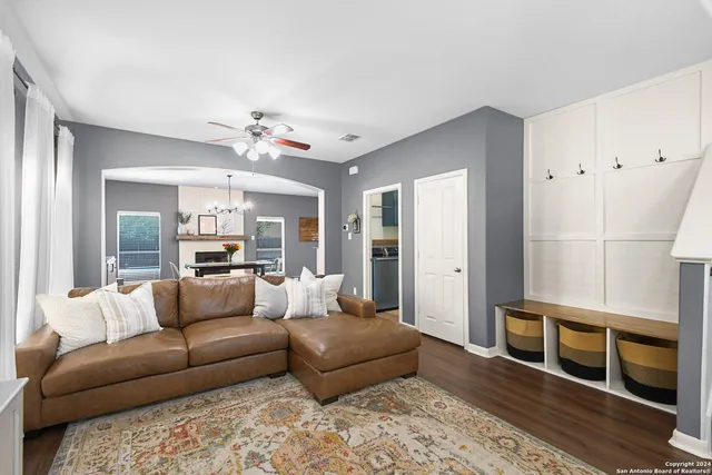 a living room with furniture and a fireplace