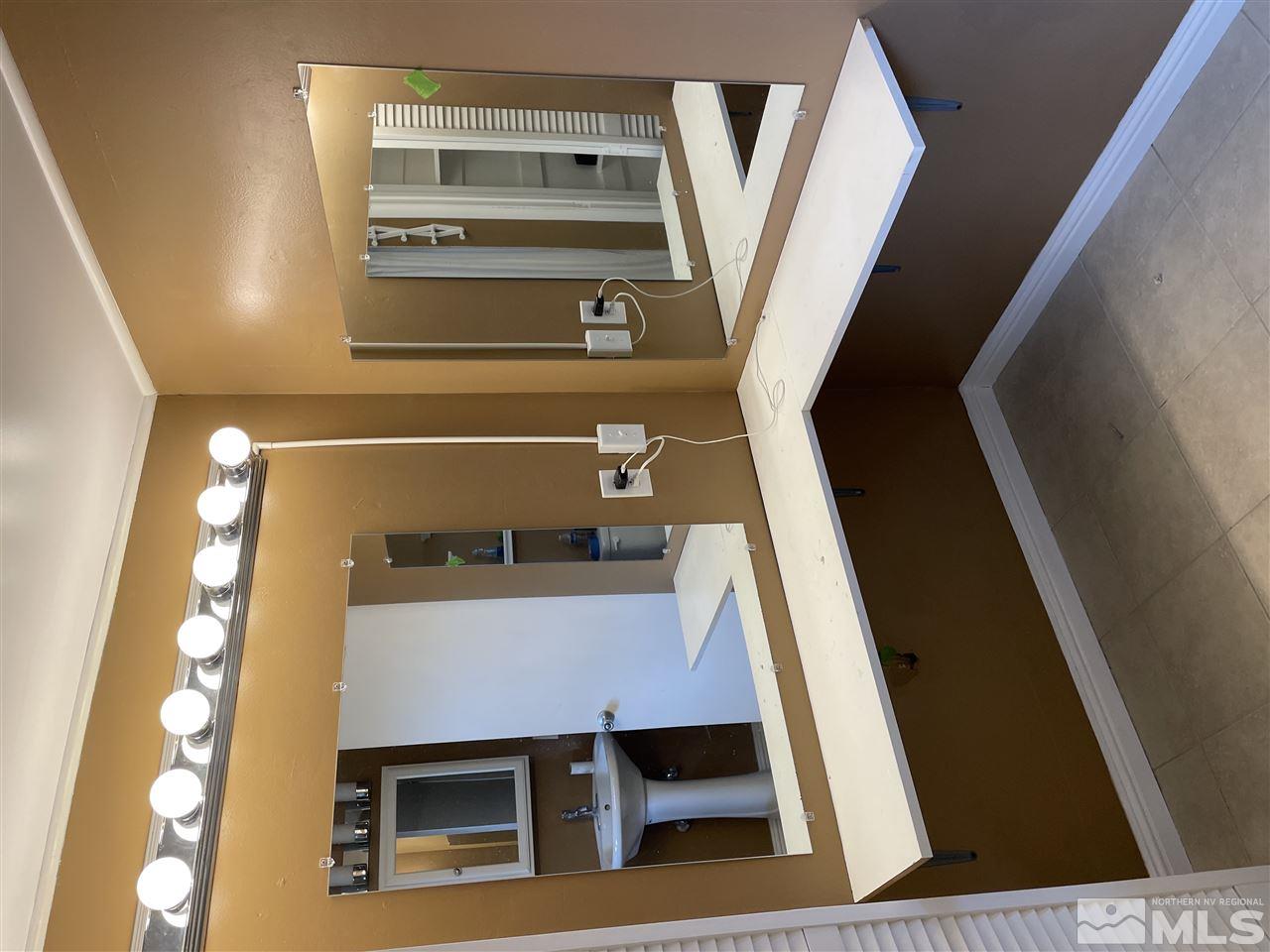 1690 Carlin Street Reno, NV 89503 - Photo 18 of 31 a bathroom with a sink and a mirror